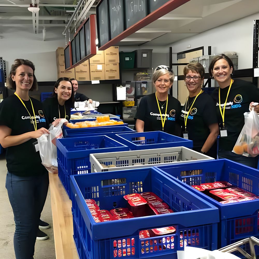 Dingman’s volunteers preparing food at Completely KIDS